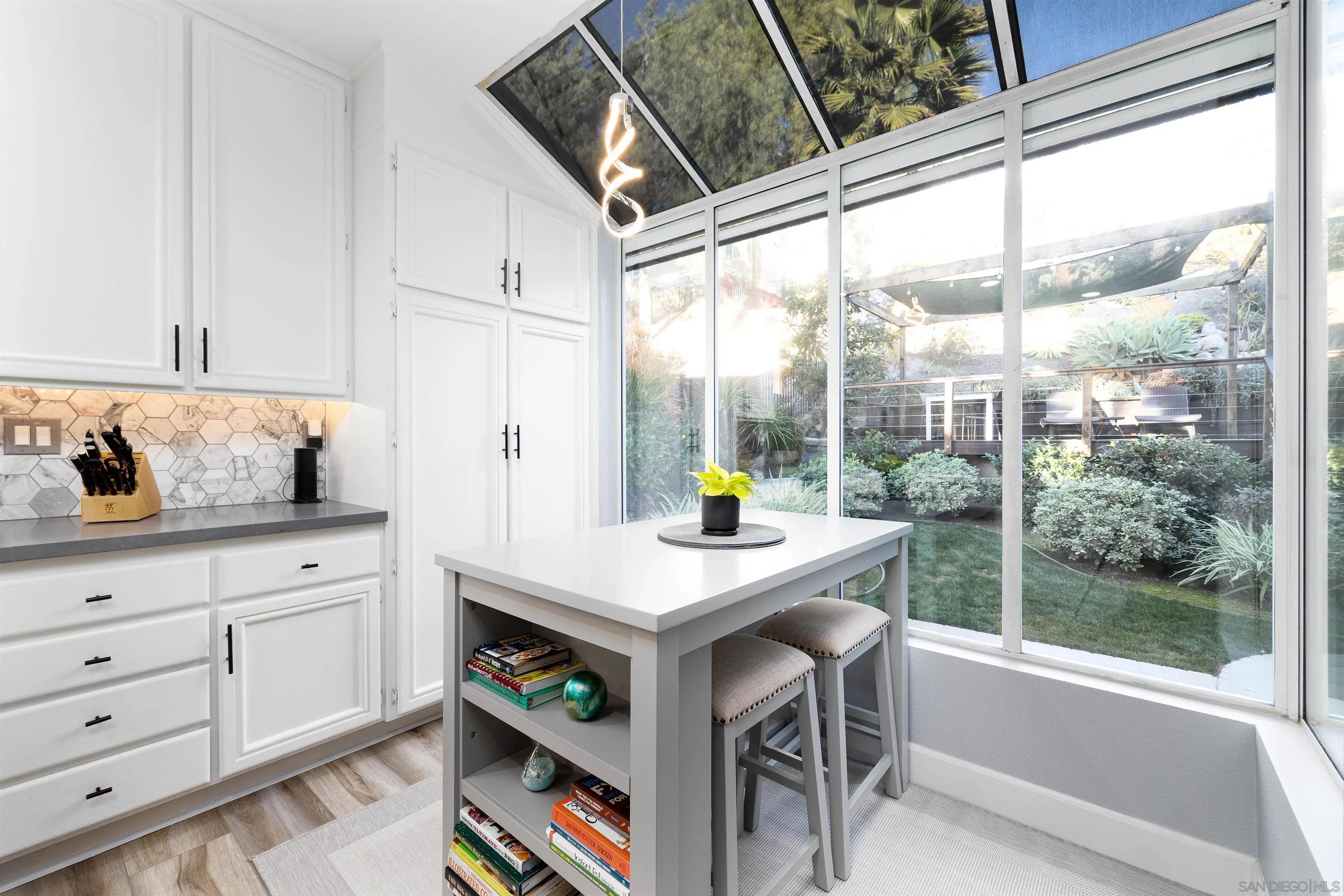 13835 Carmel Ridge Road San Diego, CA 92128 - Photo 9 of 38 a view of a kitchen with furniture and window
