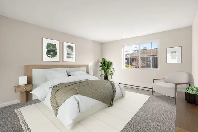 a spacious bedroom with a bed and a couch