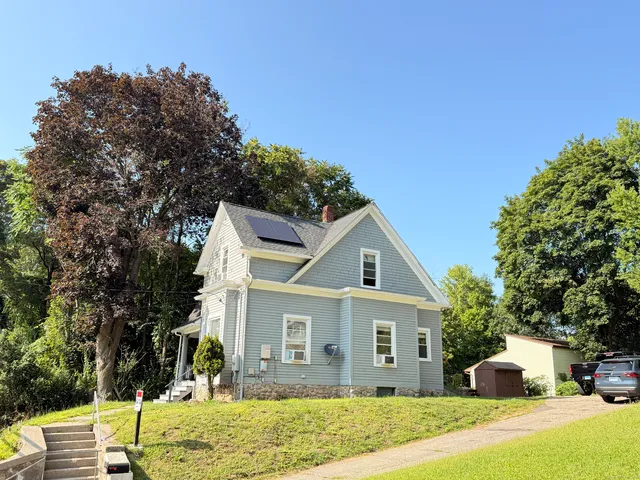 a front view of a house with a yard