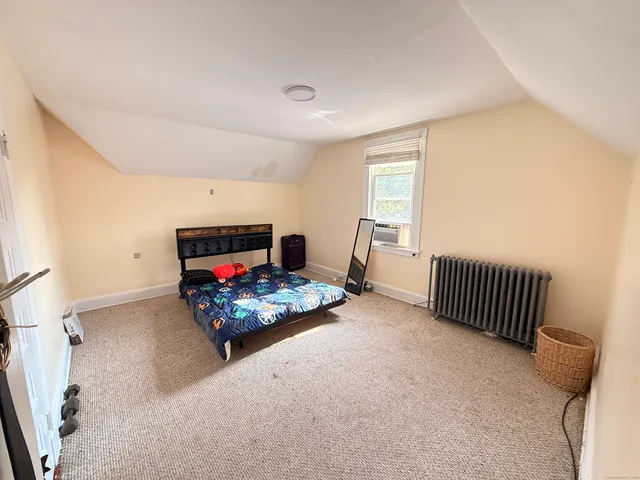 a living room with furniture fireplace and a window