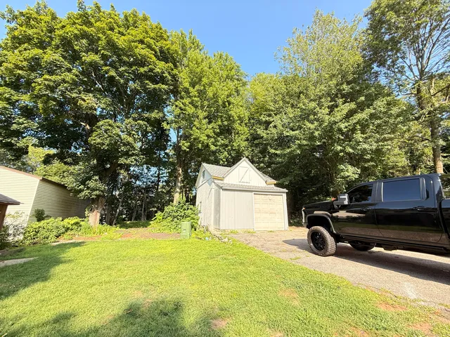 a view of a yard with a tree