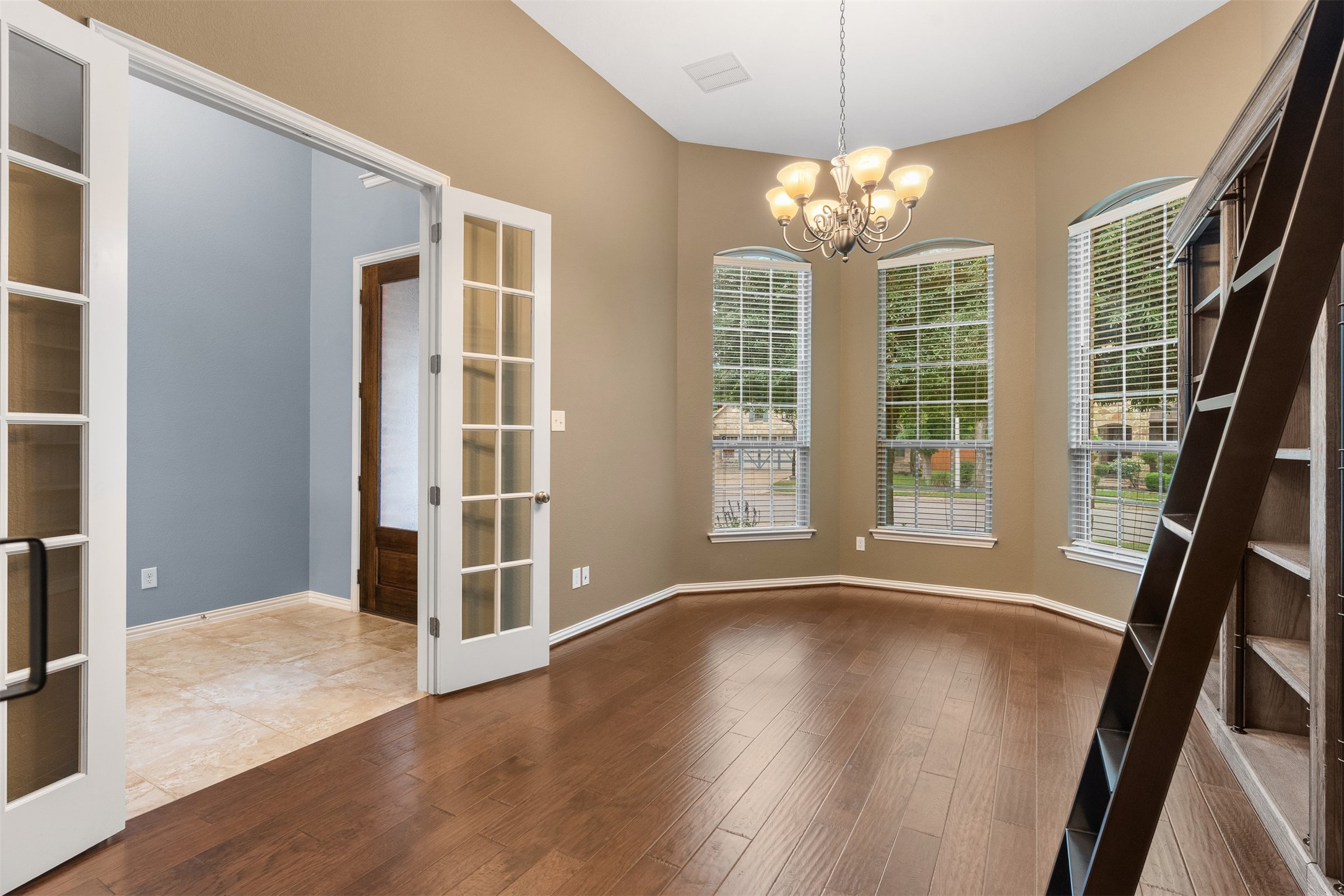 3935 Bowstring Bend Cedar Park, TX 78613 - Photo 6 of 39 Natural light fills the workspace, creating a bright atmosphere that makes working from home a breeze.