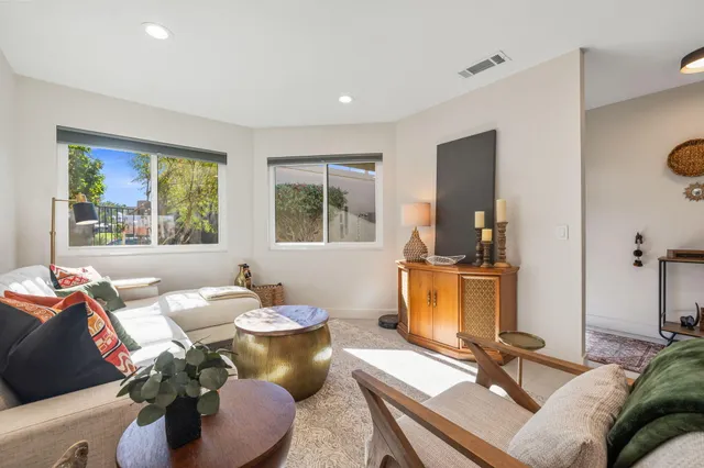 a large kitchen with kitchen island a sink stainless steel appliances and cabinets