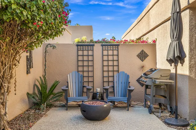 a large kitchen with a table and chairs