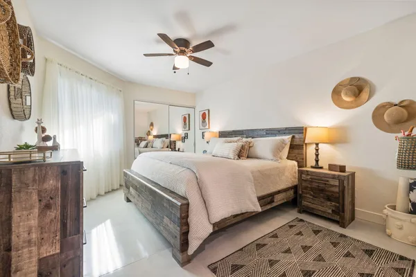 a large kitchen with kitchen island a sink stainless steel appliances and cabinets