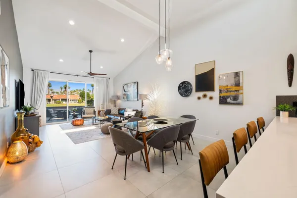 a bedroom with a bed and flat screen tv
