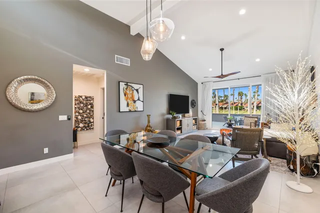 a bathroom with a double vanity sink a mirror and shower