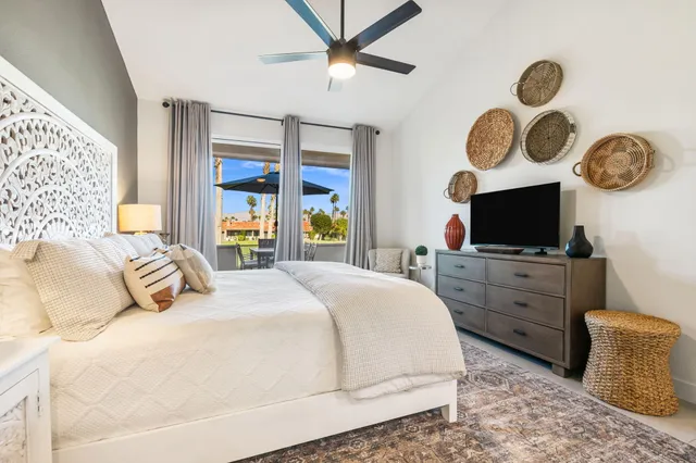 a view of a chairs and table in patio