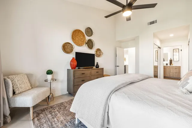 a view of an outdoor dining space with furniture and umbrella