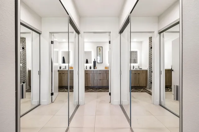 a view of a house with swimming pool and sitting area