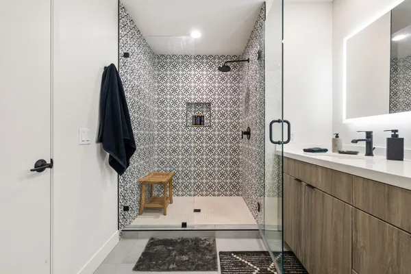 a view of a house with swimming pool and sitting area