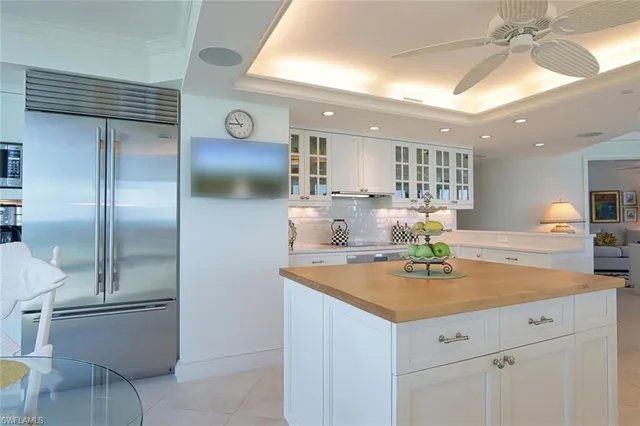a kitchen with a sink cabinets and stainless steel appliances