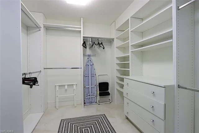 a walk in closet and a bathroom