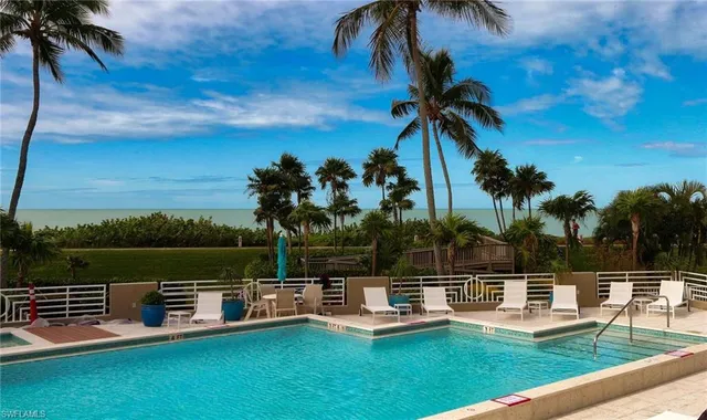a view of a yard with chairs