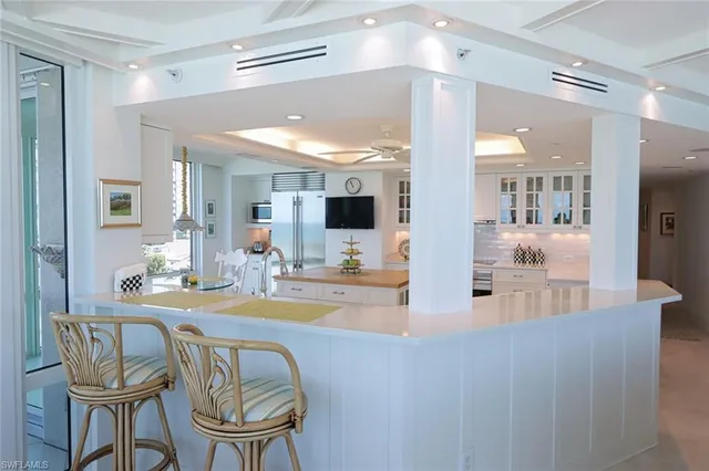 a room with dining table and chairs