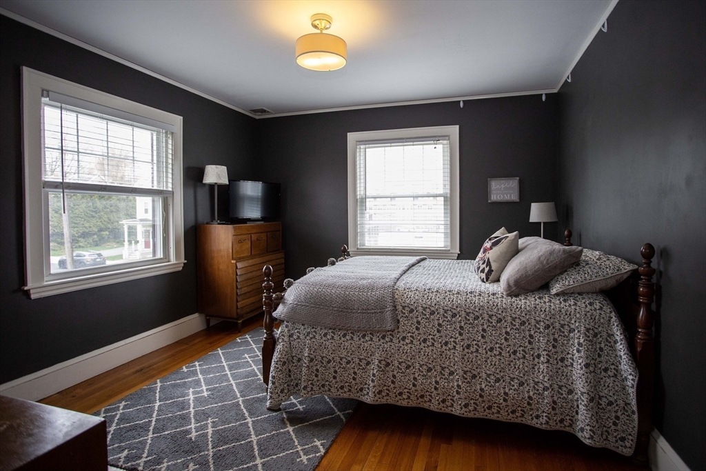 284 Main Street Wakefield, MA 01880 - Photo 23 of 42 a bedroom with a bed and window