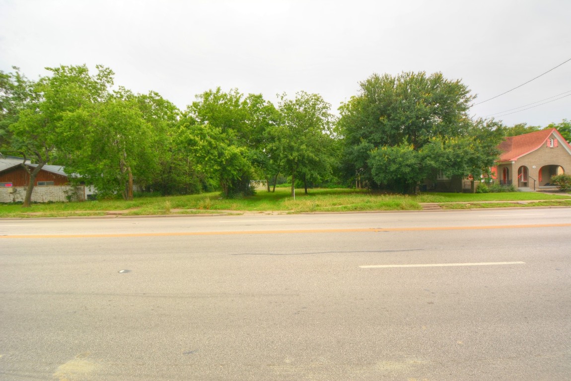 302 West University Avenue Georgetown, TX 78626 - Photo 7 of 7 a view of a house with a big yard and a large trees