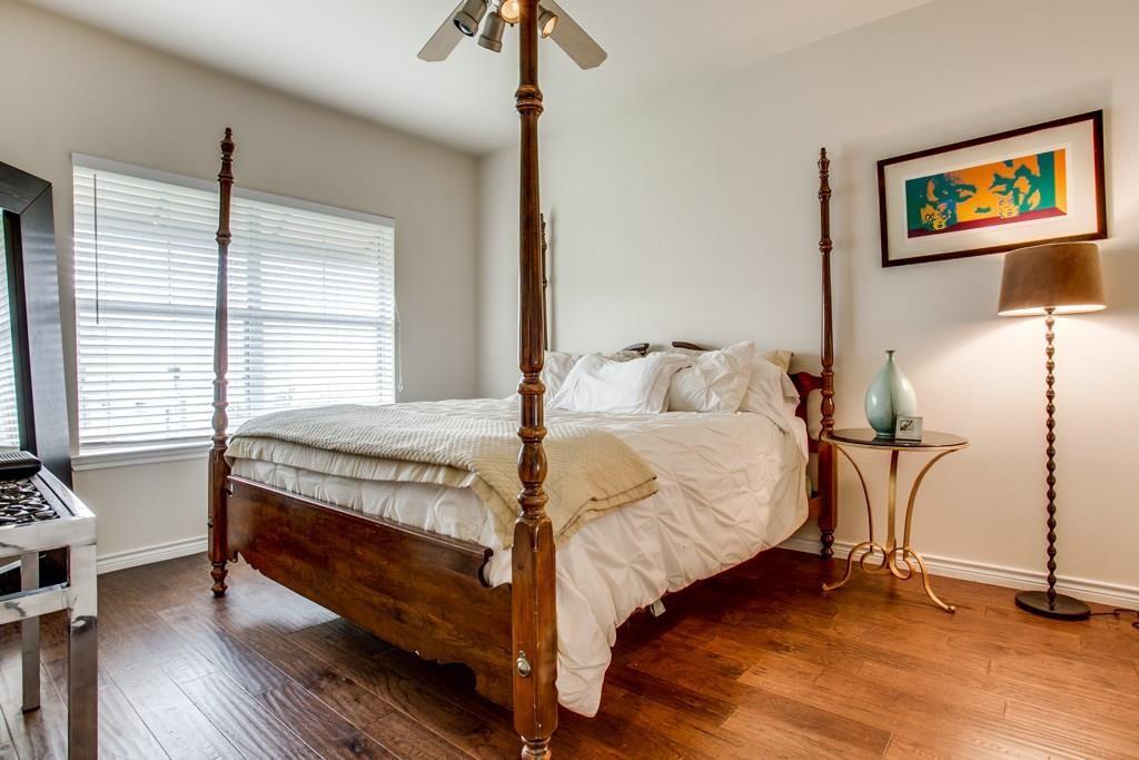 3102 Kings Road, Unit 3310 Dallas, TX 75219 - Photo 13 of 19 a bedroom with a bed and a painting on the wall