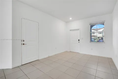 a view of an empty room and closet area