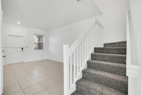 a view of an entryway with stairs