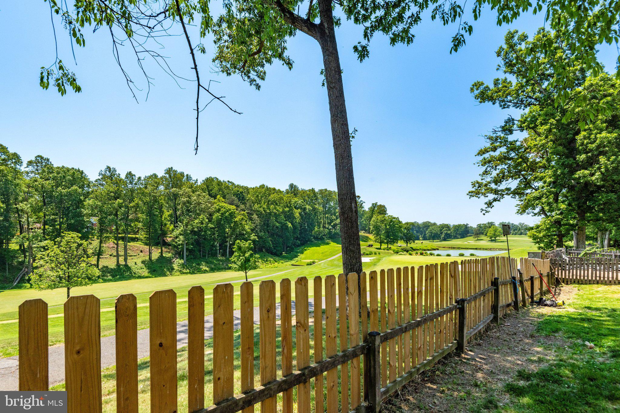 7905 Jansen Court Springfield, VA 22152 - Photo 11 of 26 a view of a wooden fence and trees