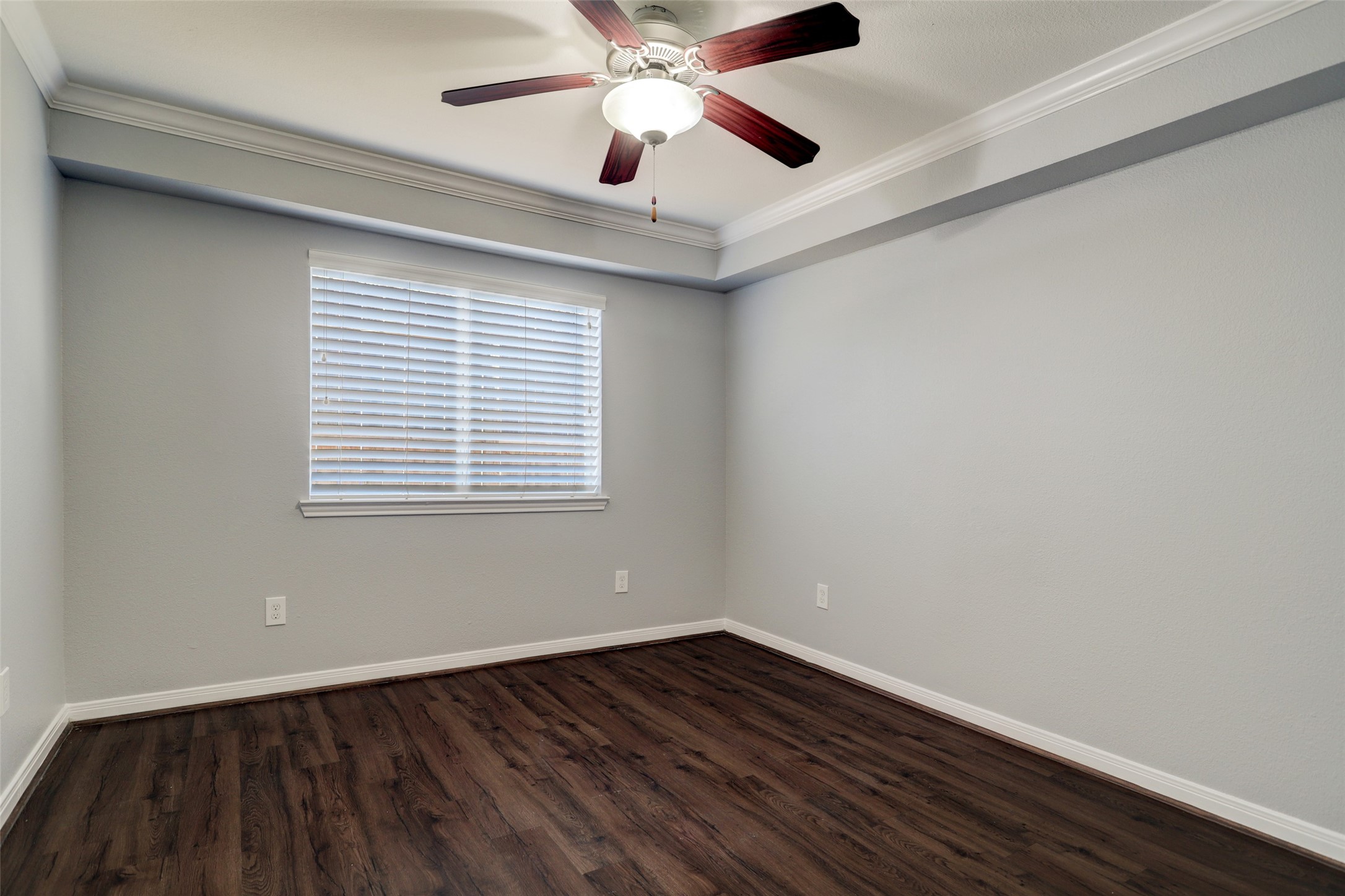 1600 West T C Jester Boulevard, Unit 1 Houston, TX 77008 - Photo 6 of 9 a view of an empty room with wooden floor and a window