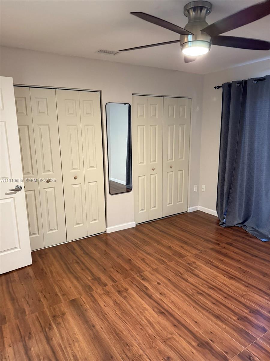 6250 Southwest 130th Avenue, Unit 703 Miami, FL 33183 - Photo 17 of 29 a view of an empty room with wooden floor