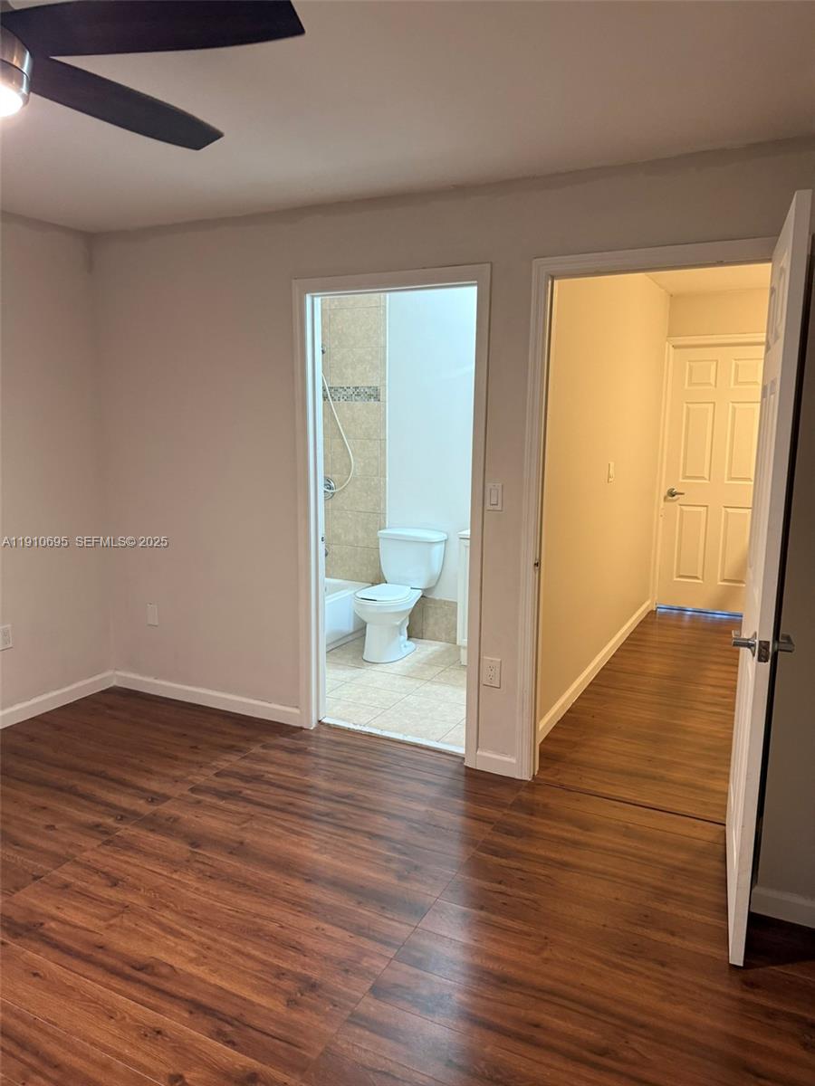 6250 Southwest 130th Avenue, Unit 703 Miami, FL 33183 - Photo 18 of 29 a view of a room with wooden floor and door