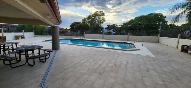 a view of a backyard with a patio