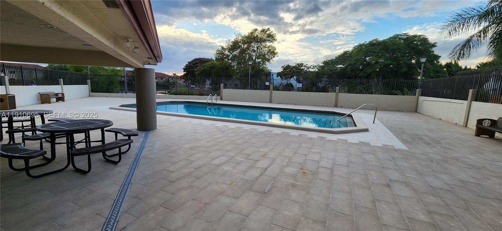 6250 Southwest 130th Avenue, Unit 703 Miami, FL 33183 - Photo 23 of 29 a view of a backyard with a patio