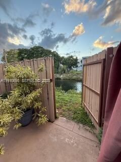 6250 Southwest 130th Avenue, Unit 703 Miami, FL 33183 - Photo 24 of 29 a view of a garden with a bench in back yard