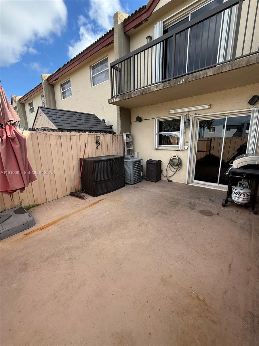6250 Southwest 130th Avenue, Unit 703 Miami, FL 33183 - Photo 26 of 29 a view of a car park in front of house