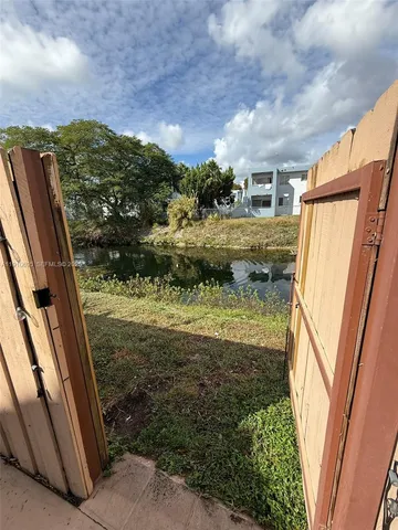 a view of a back yard from a balcony