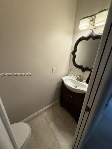 6250 Southwest 130th Avenue, Unit 703 Miami, FL 33183 - Photo 10 of 29 a bathroom with a sink and a mirror