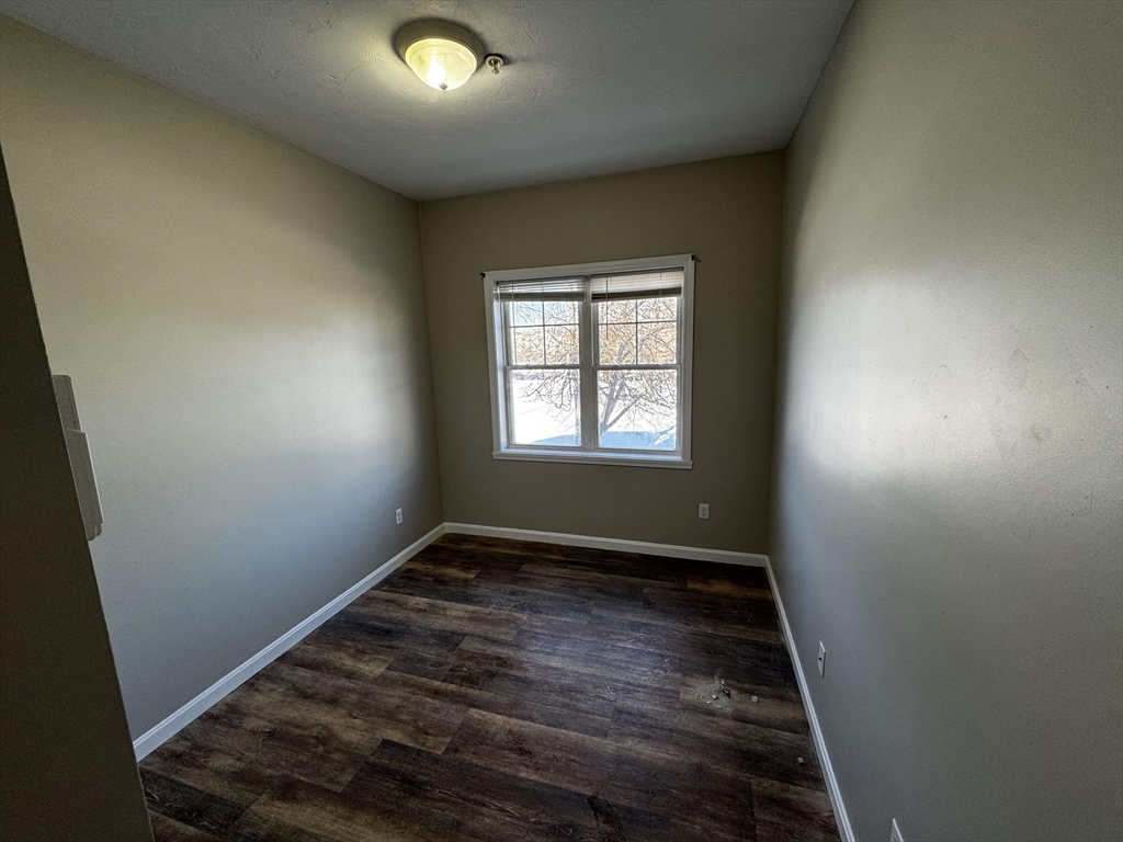 95 Park Street, Unit 2 Attleboro, MA 02703 - Photo 7 of 10 an empty room with windows