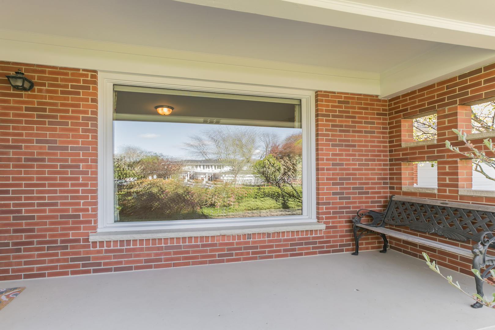 919 Meadows Road Geneva, IL 60134 - Photo 2 of 25 a view of a room with a large window and couch