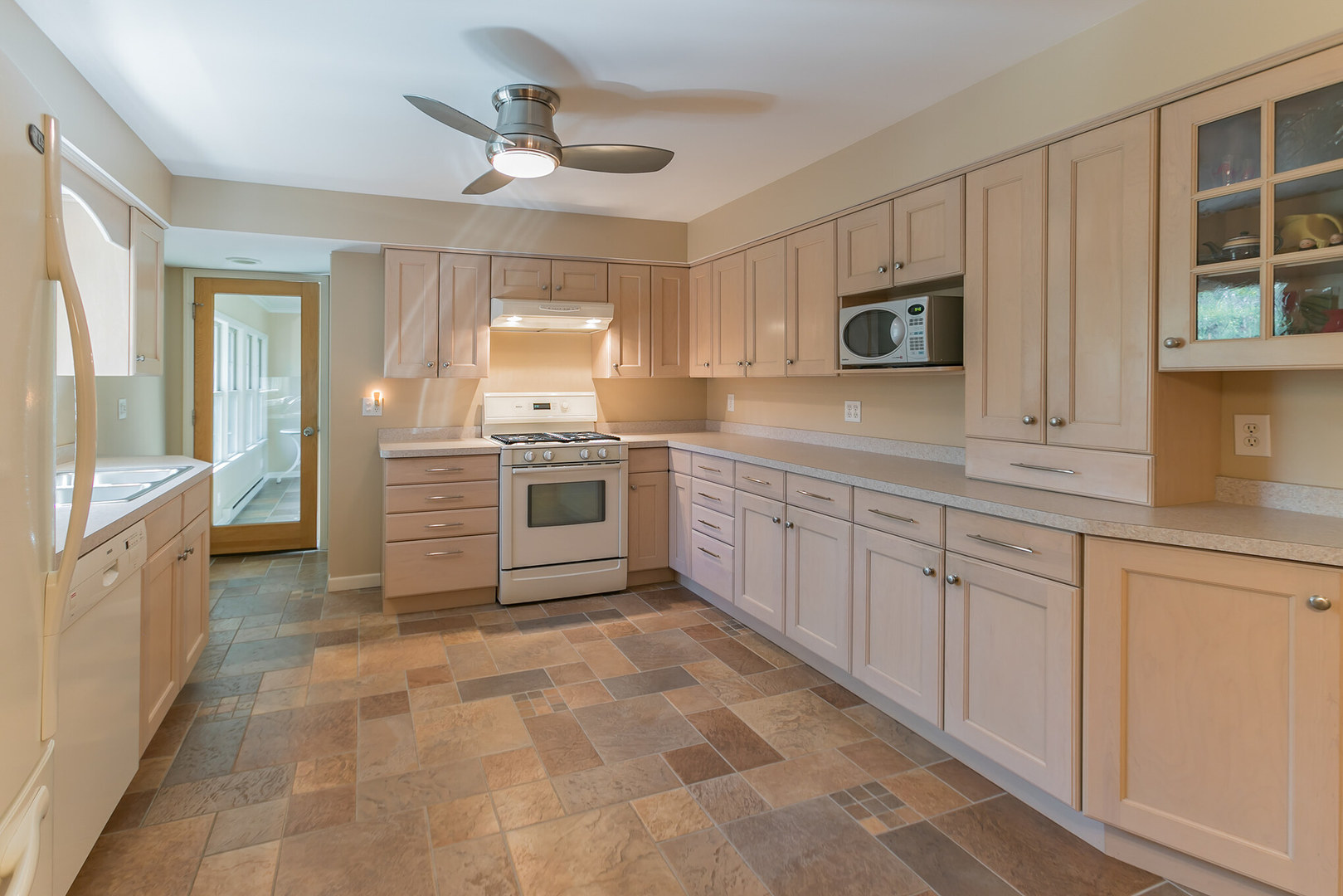 919 Meadows Road Geneva, IL 60134 - Photo 12 of 25 a kitchen with cabinets and window