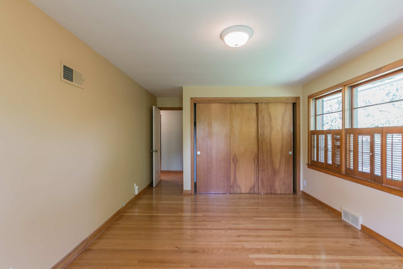 919 Meadows Road Geneva, IL 60134 - Photo 20 of 25 wooden floor in an empty room with a window