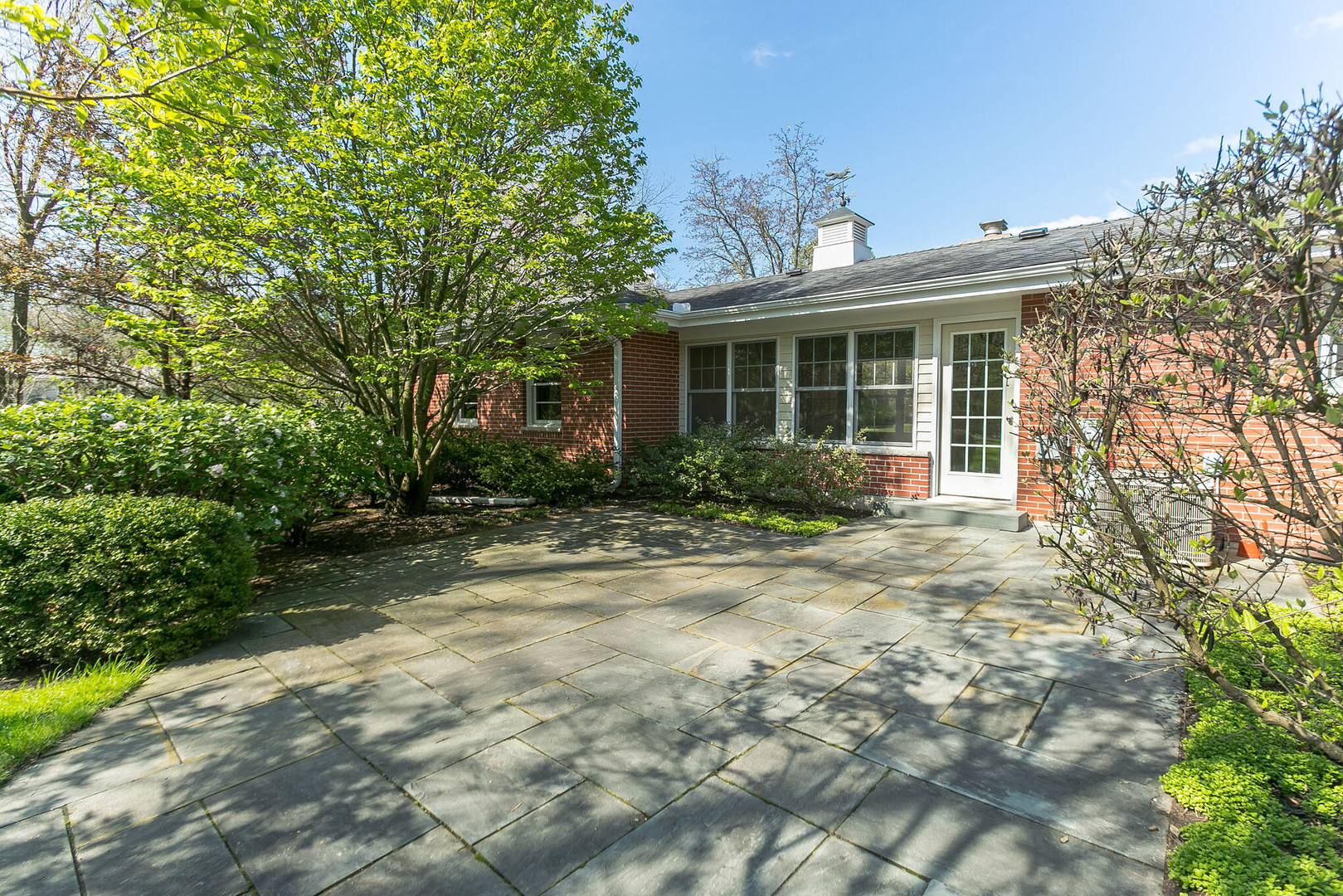 919 Meadows Road Geneva, IL 60134 - Photo 23 of 25 a front view of a house with garden