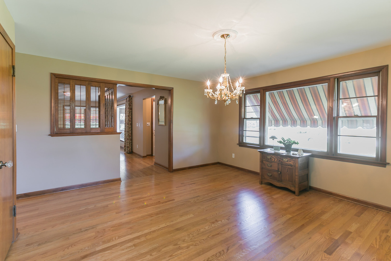 919 Meadows Road Geneva, IL 60134 - Photo 8 of 25 a view of a room with wooden floor and chandelier
