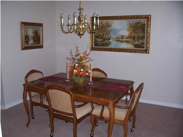 1570 Indian Woman Road Santa Rosa Beach, FL 32459 - Photo 4 of 11 a view of a dining room with furniture and chandelier