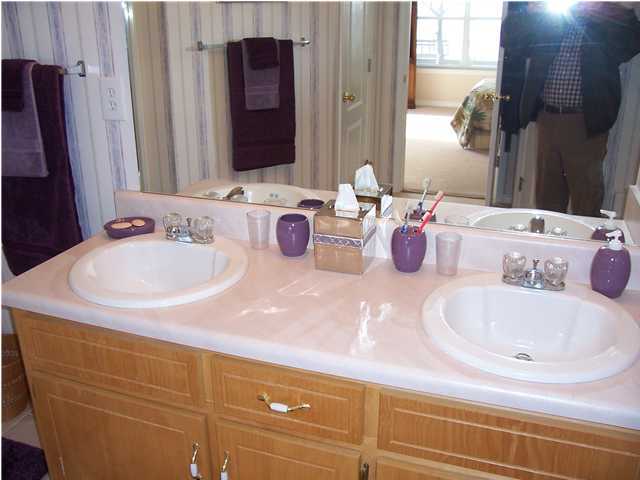 1570 Indian Woman Road Santa Rosa Beach, FL 32459 - Photo 8 of 11 a bathroom with a sink and a mirror