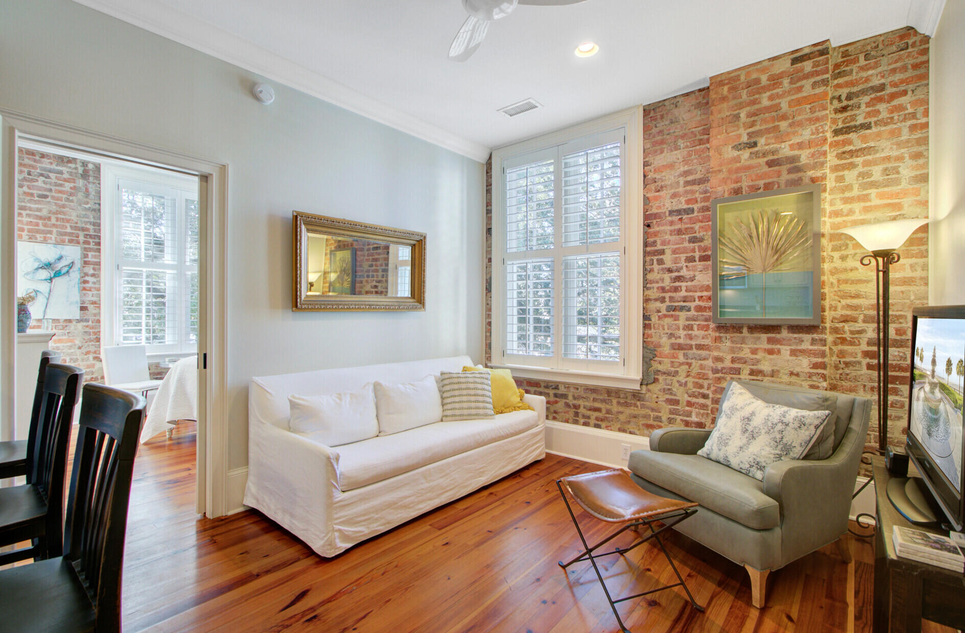 85 Cumberland Street, Unit 16 Charleston, SC 29401 - Photo 9 of 19 Living room w/exposed brick