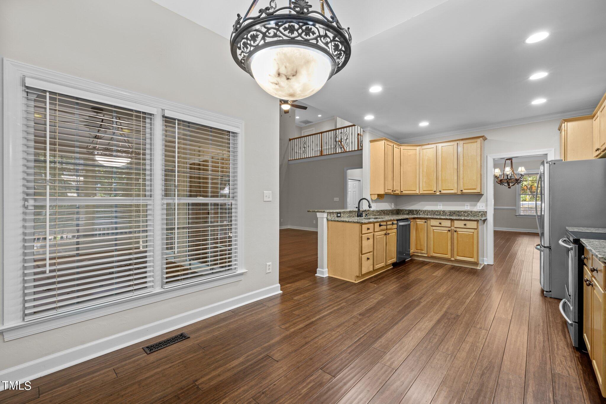 7621 Wilderness Road Raleigh, NC 27613 - Photo 16 of 60 Kitchen and Breakfast Area Open to Family Room
