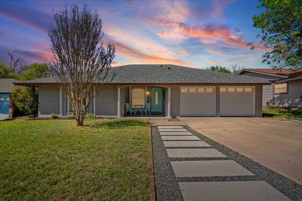 front view of a house with a garden