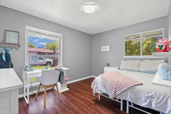 a bedroom with a bed and a window