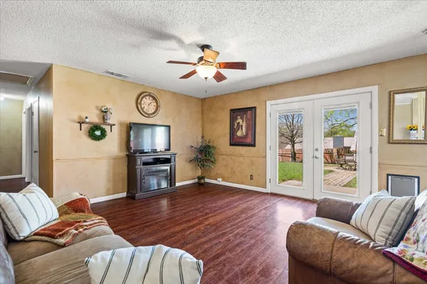 a living room with furniture and a fireplace