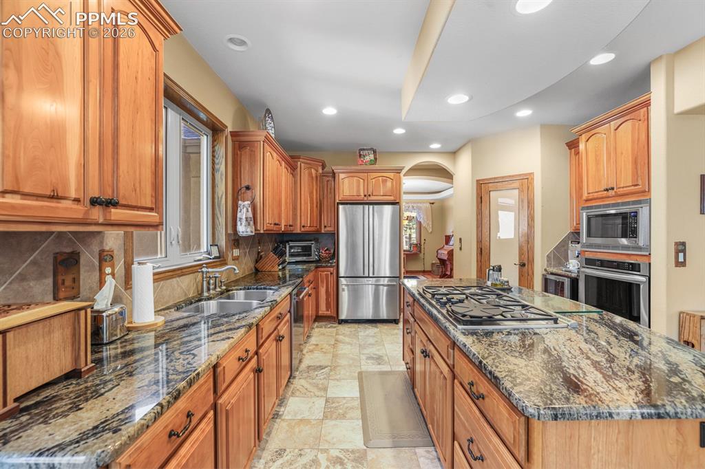 17990 Sawmill Road Colorado Springs, CO 80908 - Photo 4 of 40 Large kitchen with center island