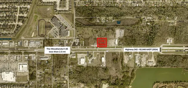 a view of swimming pool with a bench and trees in the background