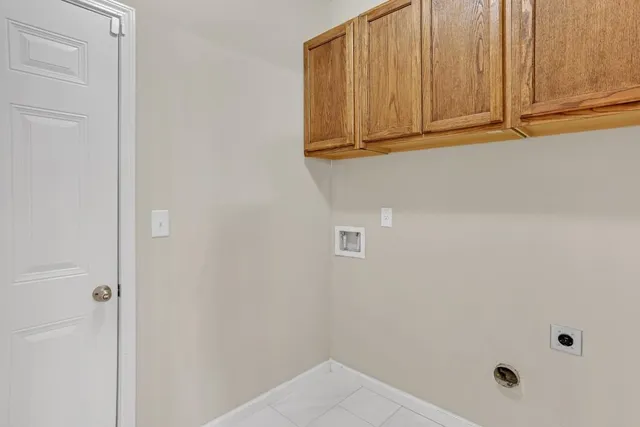 a view of a livingroom with a chandelier fireplace and window